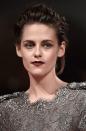 Stewart went for a vampy look at the premiere of <i>Equals</i> during the 72nd Venice Film Festival. Her bronzed porcelain skin goes fab with that burgundy lippy, maroon eye shadow and rock ’n’ roll up ‘do. A totally different ball game for Stewart going for a delicate lace gunmetal dress, very Avant-guard!