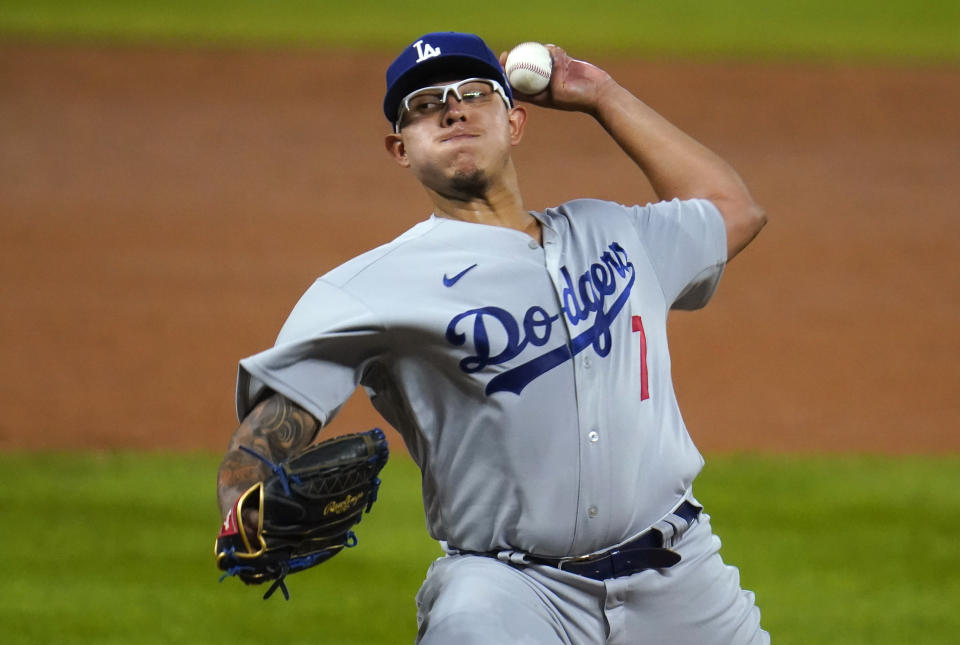 Los Angeles Dodgers starting pitcher Julio Urias works against the Colorado Rockies during the third inning of a baseball game Thursday, Sept. 17, 2020, in Denver. (AP Photo/David Zalubowski)