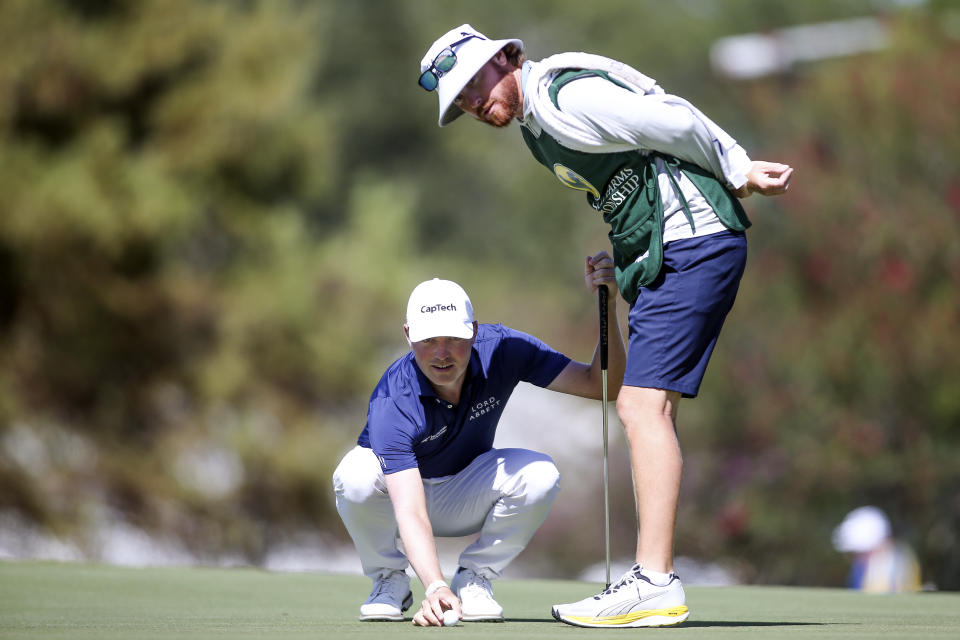 Ben Griffin lines his ball up on the first green during the third day of the Sanderson Farms Championship golf tournament in Jackson, Miss., Saturday, Oct 7, 2023. (James Pugh/impact601.com via AP)