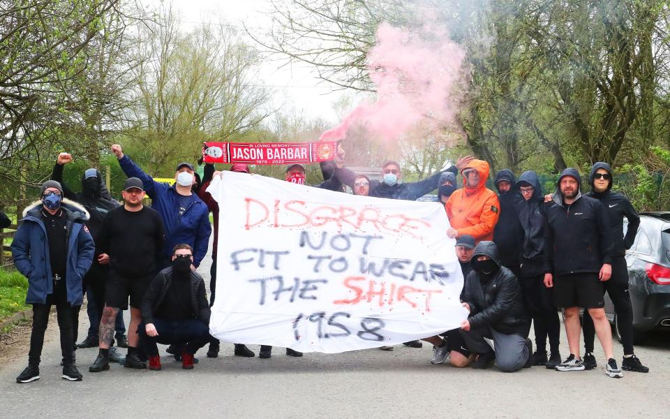 A group of Manchester United fans staged a peaceful protest at The AON Carrington Training Complex on Friday morning and leaft after 2 hours with the team not due into training until after 2.00pm. - Eamonn and James Clarke 