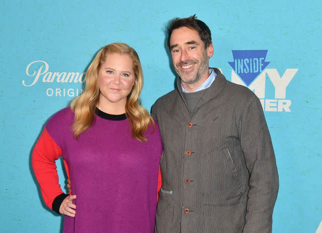 <p>ANGELA WEISS/AFP via Getty</p> US actress and comedian Amy Schumer and her husband chef Chris Fischer arrive for the season five New York premiere of Inside Amy Schumer, at the Pendry Hotel in New York City on October 18, 2022.