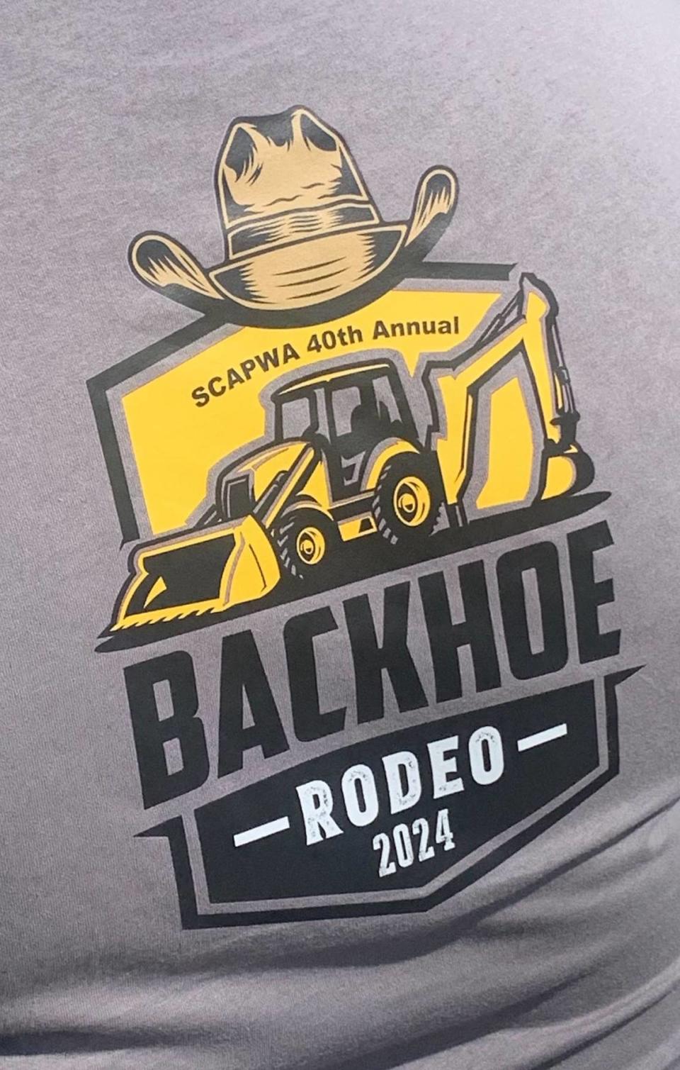 Public works employees from across the Midlands competed Friday to show who is the best backhoe operator in the region. The winners advance to a state competition and then compete to attend a national competition. This photo shows the shirts commemorating the Midlands event, May 24, 2024