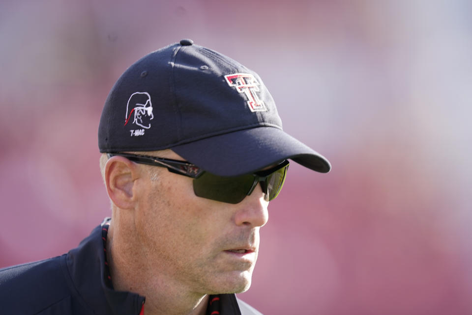 Texas Tech head coach Matt Wells runs off the field at the end of the first half of an NCAA college football game against Iowa State, Saturday, Oct. 10, 2020, in Ames, Iowa. (AP Photo/Charlie Neibergall)