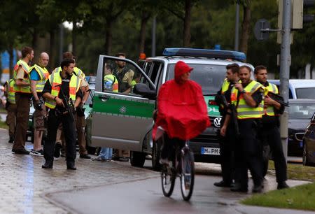 Police secure a street near to the scene of a shooting in Munich, Germany July 22, 2016. REUTERS/Michael Dalder