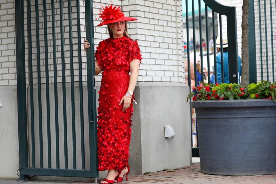 Andrea Burns wears a red rose dress at Churchill Downs in Louisville, Ky., Saturday, May 4, 2024.