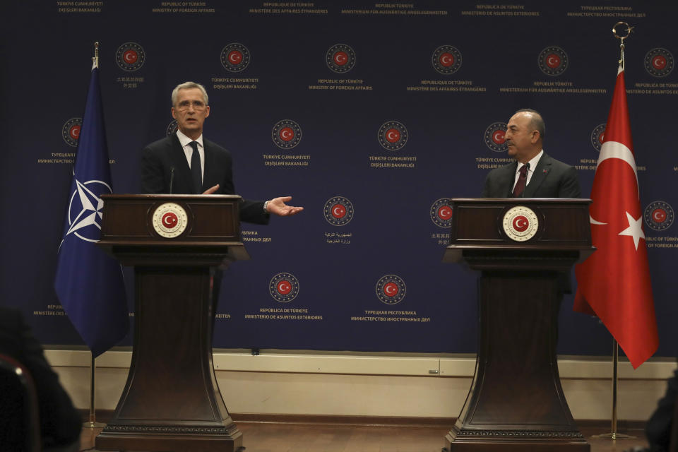 Turkey's Foreign Minister Mevlut Cavusoglu, right, NATO Secretary General Jens Stoltenberg speak at a joint press conference after their talks in Ankara, Turkey, Thursday, Feb. 16, 2023. Stoltenberg is in Turkey to meet with President Recep Tayyip Erdogan and Foreign Minister Mevlut Cavusoglu in Ankara, and to visit areas affected by the deadly quakes.(AP Photo/Burhan Ozbilici)