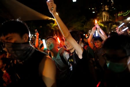 Anti-government protesters dance during the Mid-Autumn Festival, in Sha Tin