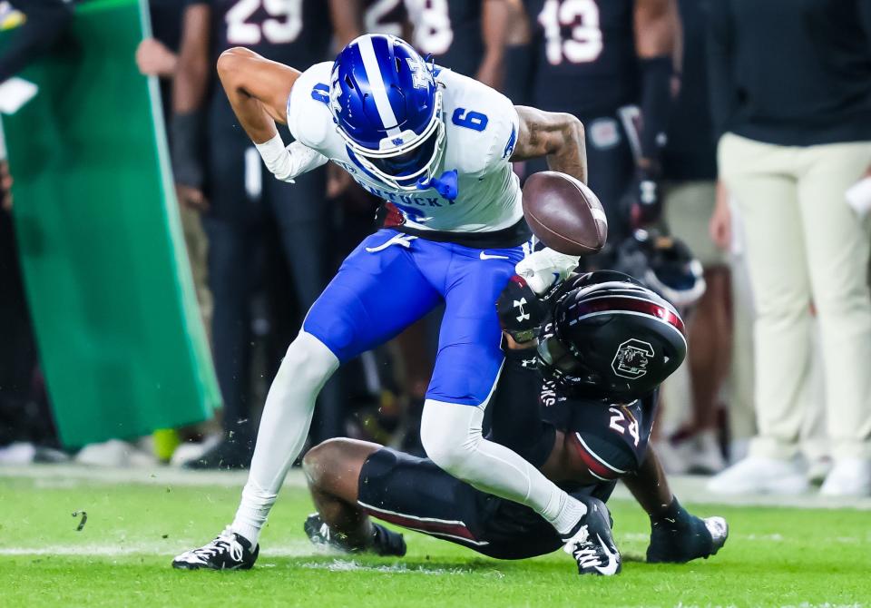 Kentucky Wildcats wide receiver Dane Key (6) fumbles as he is hit by South Carolina Gamecocks defensive back Jalon Kilgore (24) in the second quarter at Williams-Brice Stadium.