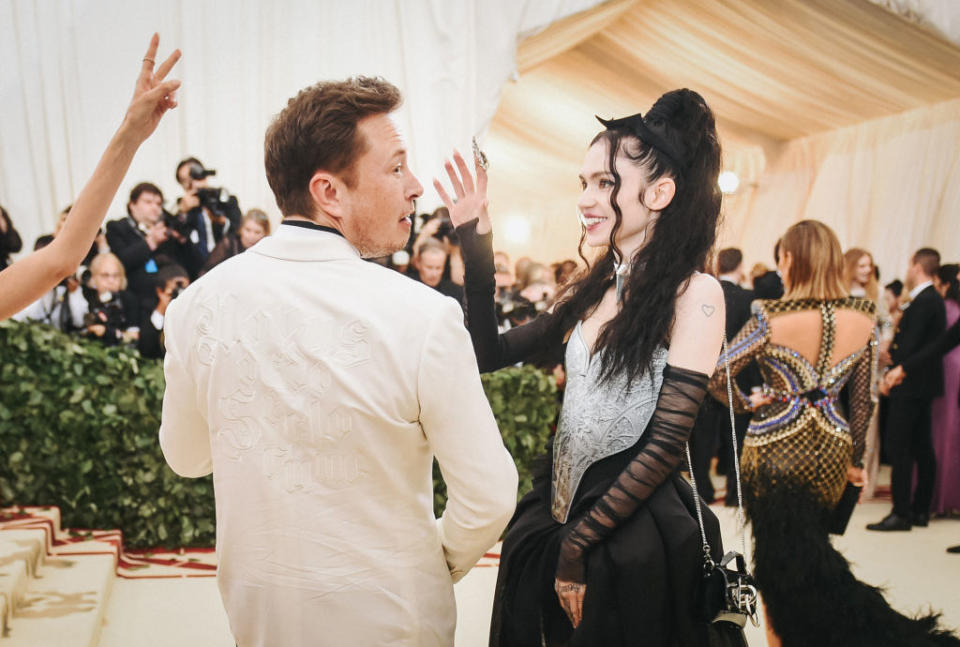 Elon and Grimes on the Met Gala stairs