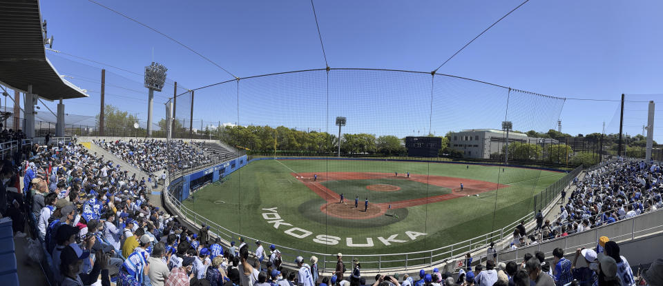 Fans arrive at a stadium as baseball player Trevor Bauer is scheduled to pitch in a game in Yokosuka, Japan, Sunday, April 16, 2023. Bauer pitched four innings Sunday for the Yokohama BayStars minor league team in Yokosuka as he prepares to pitch his first game for the Yokohama team. (AP Photo/Steve Wade)