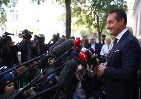 Top candidate and head of far-right Freedom Party (FPOe) Heinz-Christian Strache talks with journalists in front of a polling station in Vienna, Austria October 15, 2017. REUTERS/Michael Dalder