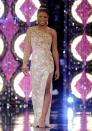 <p>Djuan Keila Trent of Kentucky opted for a one-shoulder sequined gown and statement earrings—a big accessory trend of the early 2010s.</p>