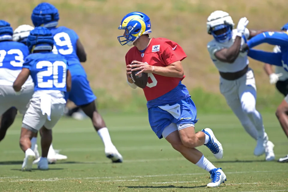 May 28, 2024; Thousand Oaks, CA, USA; Los Angeles Rams quarterback Matthew Stafford (9) looks to pass during OTAs at the team training facility at California Lutheran University. Mandatory Credit: Jayne Kamin-Oncea-USA TODAY Sports