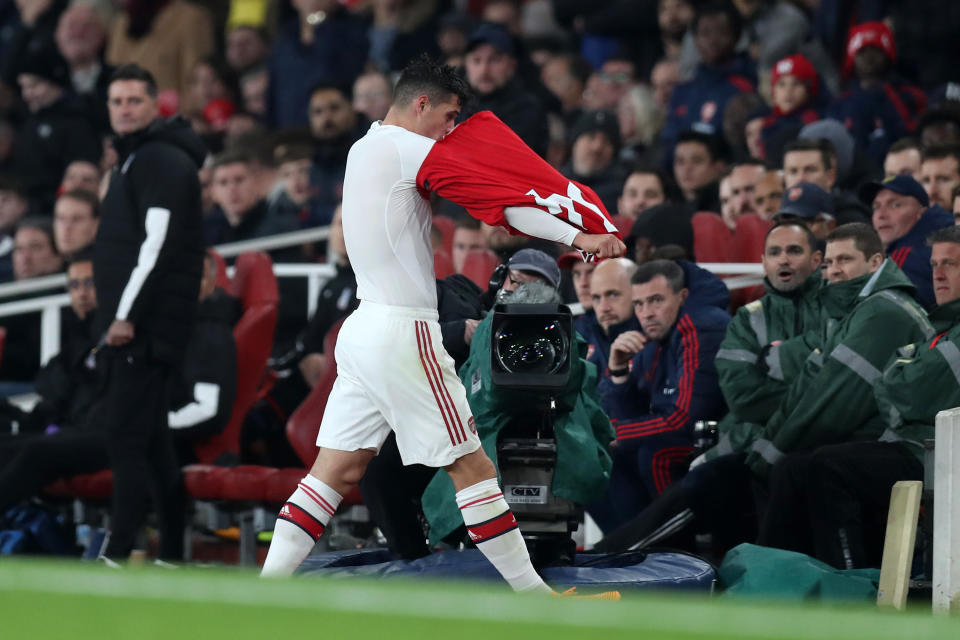 Arsenal's Granit Xhaka takes off his jersey and heads down the tunnel after being substituted on Sunday. (Getty)