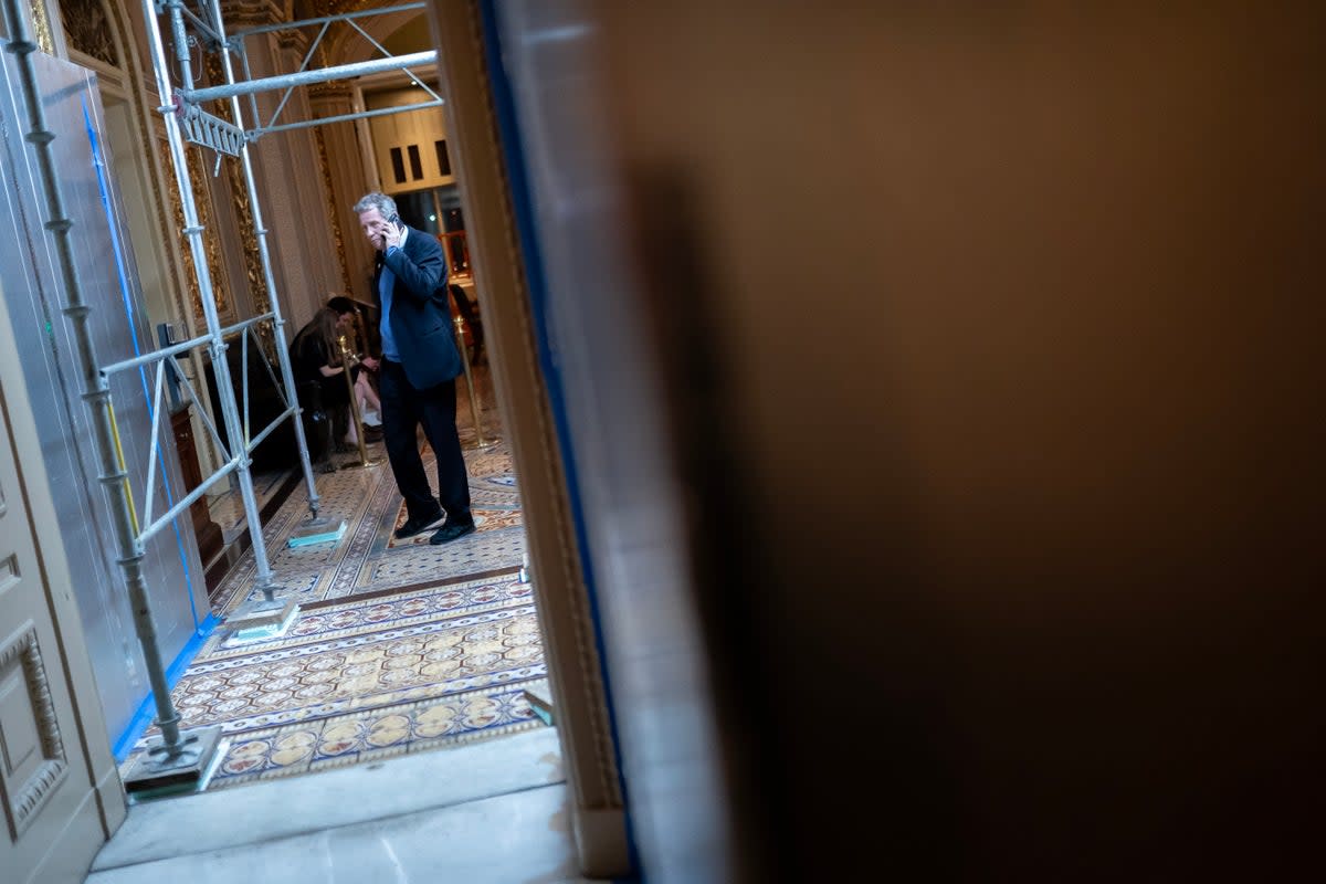 WASHINGTON, DC - MARCH 23: U.S. Sen. Sherrod Brown (D-OH) talks on the phone near the Senate Chambers on  March 23, 2024 in Washington, DC. The House of Representatives passed a $1.2 trillion spending bill to fund the government through September and avert a partial shutdown. The legislation will now go to the Senate for consideration. (Photo by Nathan Howard/Getty Images) (Getty Images)