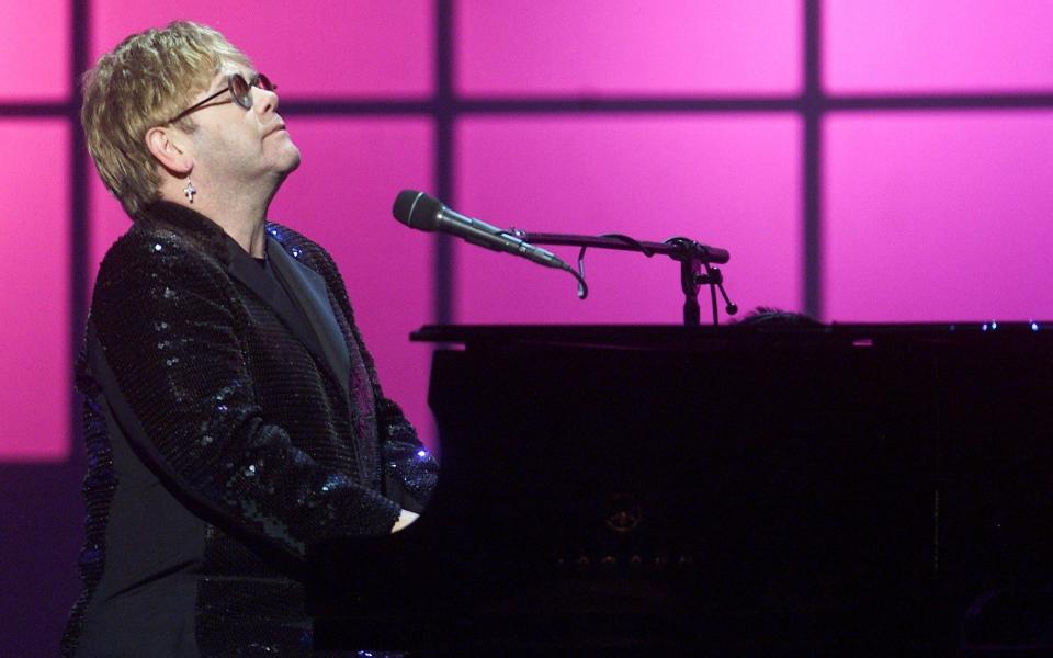 Elton John performing in 2001 - Credit: AP