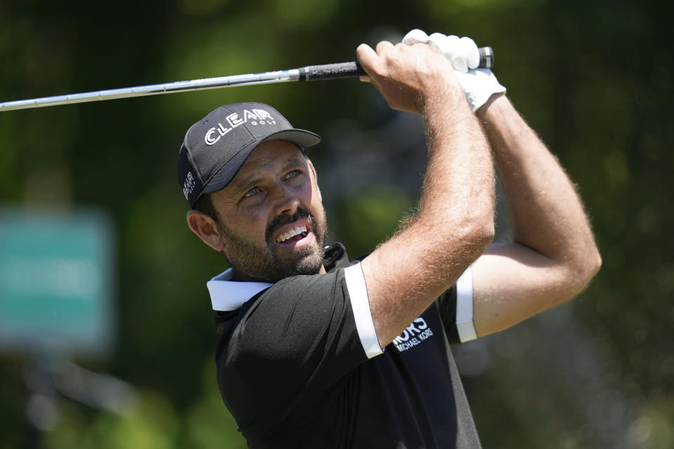 Charl Schwartzel, of South Africa, hits off the third tee during the final round of the PGA Zurich Classic golf tournament at TPC Louisiana in Avondale, La., Sunday, April 25, 2021. (AP Photo/Gerald Herbert)