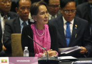 Myanmar leader Aung San Suu Kyi listens to speeches during the ASEAN Plus China Summit in the ongoing 33rd ASEAN Summit and Related Summits Wednesday, Nov. 14, 2018 in Singapore. (AP Photo/Bullit Marquez)