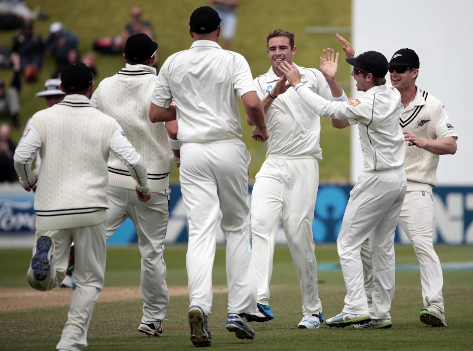 New Zealand's Tim Southee (3rd R) celebrates the dismissal of India's Murali Vijay during the second innings of play on day five of the second international test cricket match at the Basin Reserve in Wellington, February 18, 2014.