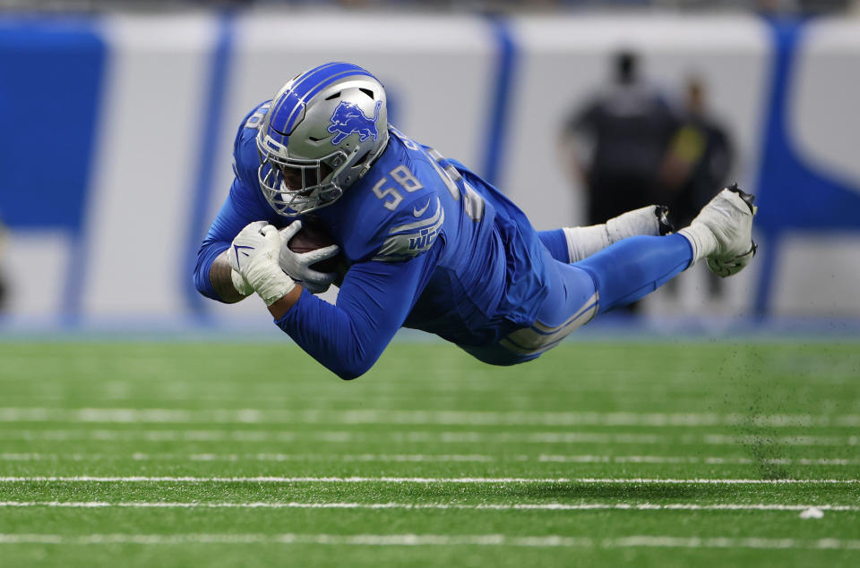 Offensive tackle Penei Sewell of the Detroit Lions dives for a first down after a big catch last week vs. Minnesota. (Photo by Mike Mulholland/Getty Images)