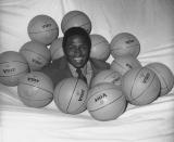 FILE - New York Knicks NBA player Willis Reed is surrounded by basketballs in New York, May 14, 1970, where he received his award as the NBAs Most Valuable Player. Willis Reed, who dramatically emerged from the locker room minutes before Game 7 of the 1970 NBA Finals to spark the New York Knicks to their first championship and create one of sports’ most enduring examples of playing through pain, died Tuesday, March 21, 2023. He was 80. Reed's death was announced by the National Basketball Retired Players Association, which confirmed it through his family. (AP Photo/Anthony Camerano, File)
