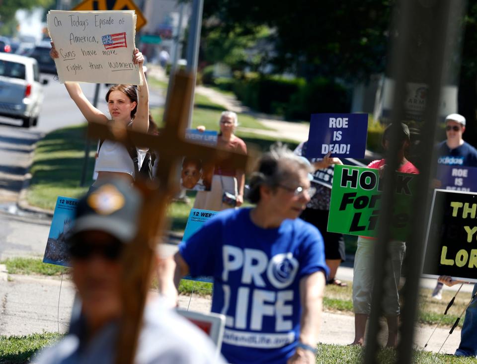 Abortion rights supporters and abortion opponents gathered in front of Planned Parenthood in Livonia, Michigan, on June 24 after the U.S. Supreme Court overturned Roe v. Wade and a constitutional right to abortion.