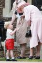 <p>Queen Elizabeth chats with Prince George as they leave Princess Charlotte's christening. </p>