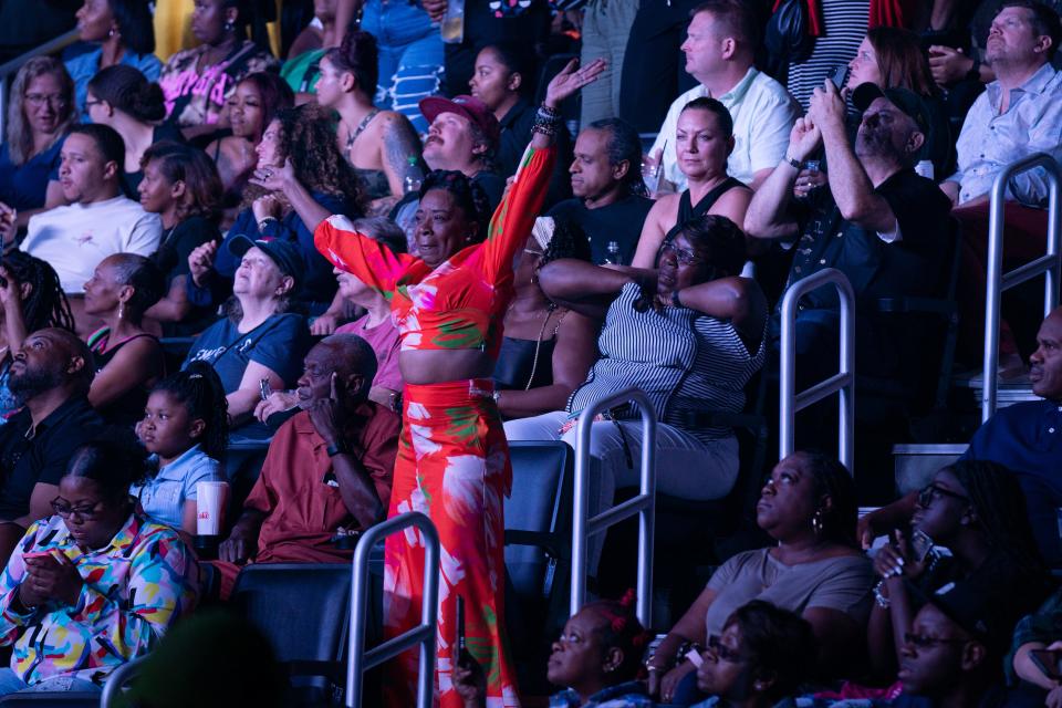 A fan dances during a concert at Little Caesars Arena in Detroit on Monday, July 17, 2023.
