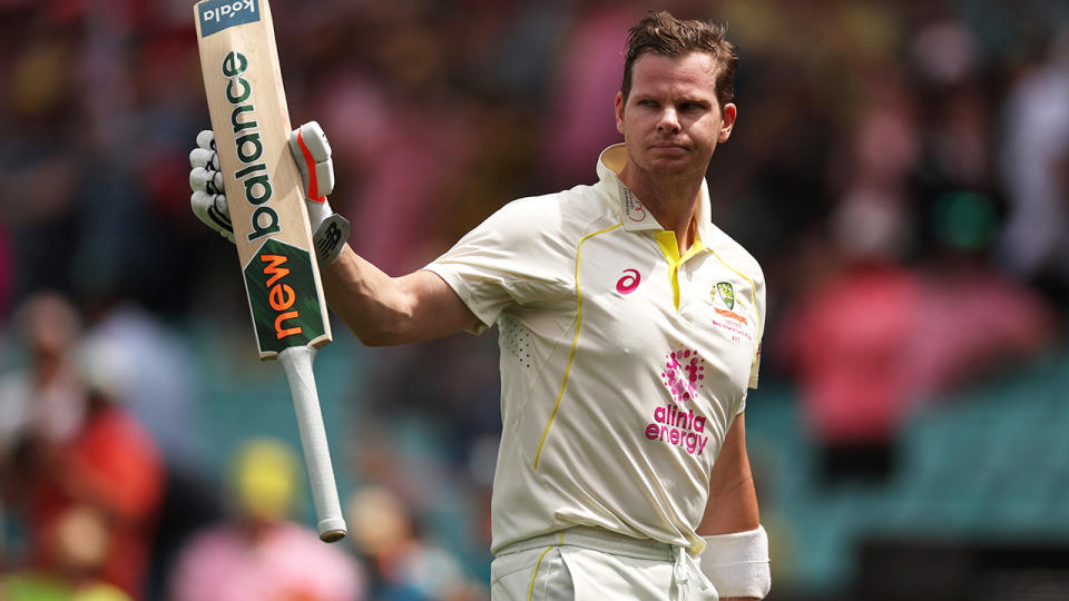 Steve Smith raises his bat after hitting his 30th test hundred. (Photo by Cameron Spencer/Getty Images)