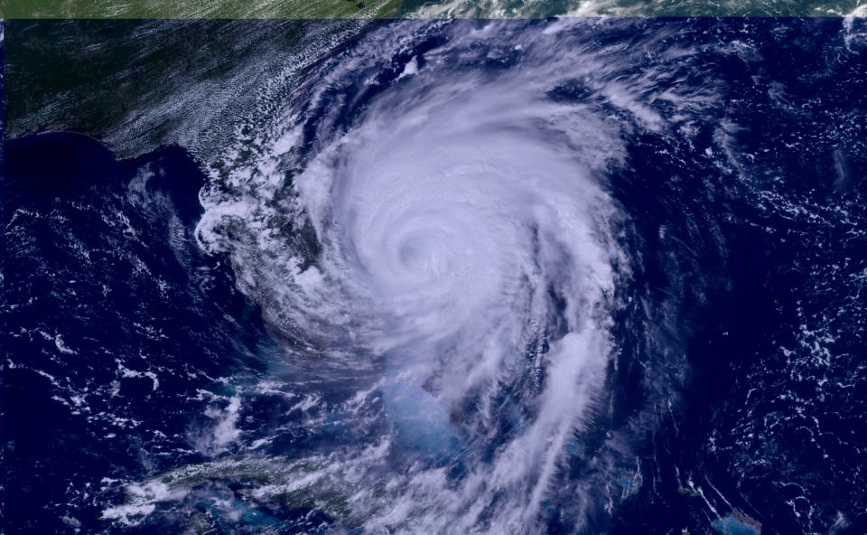 This GOES-16, GeoColor satellite image taken Tuesday, Sept. 3, 2019, at 17:10 UTC and provided by National Oceanic and Atmospheric Administration (NOAA), shows Hurricane Dorian moving off the east coast of Florida in the Atlantic Ocean. (NOAA via AP)