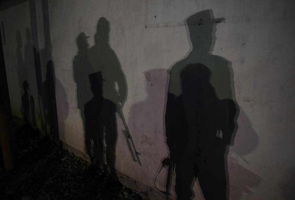 <p>The shadows of Afghan police officers are seen near the site of an attack on the Spanish embassy compound in Kabul on December 11, 2015. Insurgents have launched an attack on a Spanish embassy compound in Kabul on December 11, Afghan officials said, following reports of gunfire and a massive car bomb in the centre of the city. (Photo: Shah Marai/ AFP/Getty Images) </p>