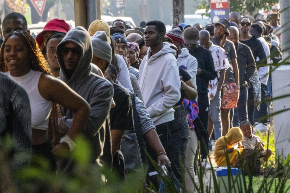 Thousands of voters line up to cast their ballot near Wits University, Wednesday May 29, 2024 for the general elections in Johannesburg, South Africa. South Africans are voting in an election seen as their country's most important in 30 years, and one that could put them in unknown territory in the short history of their democracy, the three-decade dominance of the African National Congress party being the target of a new generation of discontent in a country of 62 million people — half of whom are estimated to be living in poverty. (AP Photo/Jerome Delay)