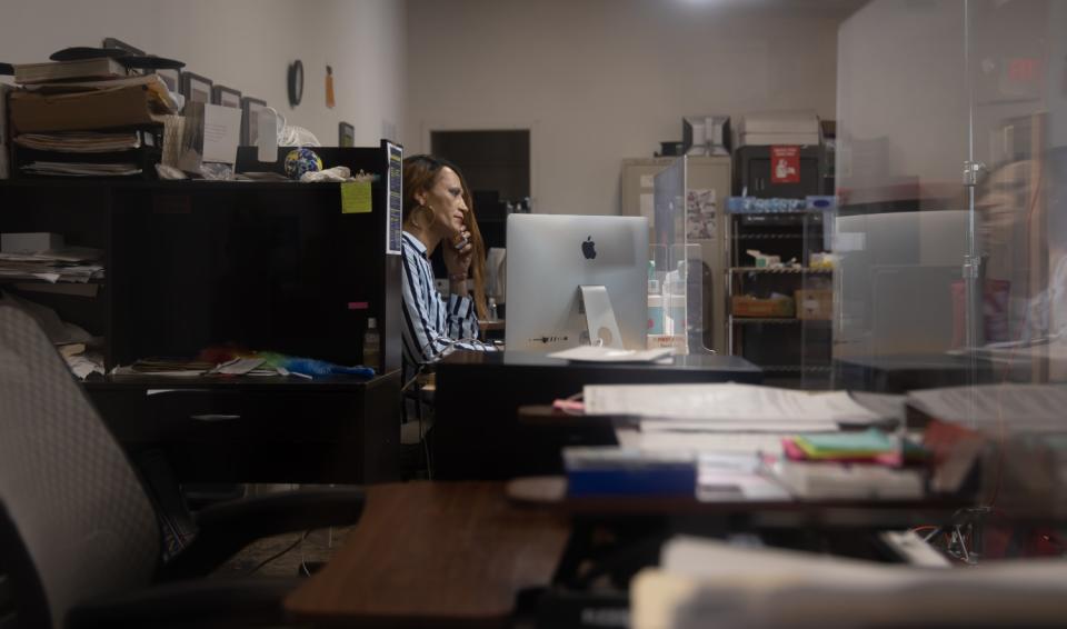 Legal assistant Jasmine Jones at a desk