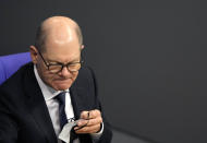 German Chancellor Olaf Scholz attends a debate about a vaccination mandate at the parliament Bundestag in Berlin, Germany, Wednesday, Jan. 26, 2022. (AP Photo/Markus Schreiber)