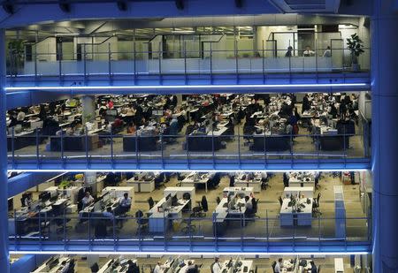 Staff work inside the HSBC headquarters in Hong Kong in this November 3, 2015 file photo. REUTERS/Bobby Yip/Files