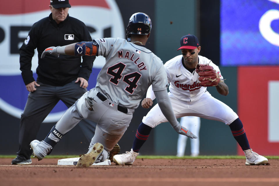 Cleveland Guardians shortstop Brayan Rocchio, right, prepares to tag out Detroit Tigers' Justyn-Henry Malloy (44) as Malloy attempts to stretch a single into a double in the fifth inning during Game 2 of baseball's AL Division Series, Monday, Oct. 7, 2024, in Cleveland. (AP Photo/Phil Long)