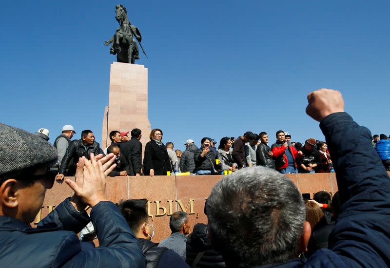 People attend a rally following post-election protests during which opposition groups took control of most of the government's apparatus, in Bishkek