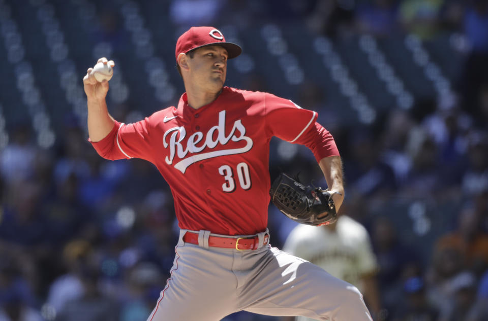 Cincinnati Reds starting pitcher Tyler Mahle throws to the Milwaukee Brewers during the first inning of a baseball game Wednesday, June 16, 2021, in Milwaukee. (AP Photo/Jeffrey Phelps)