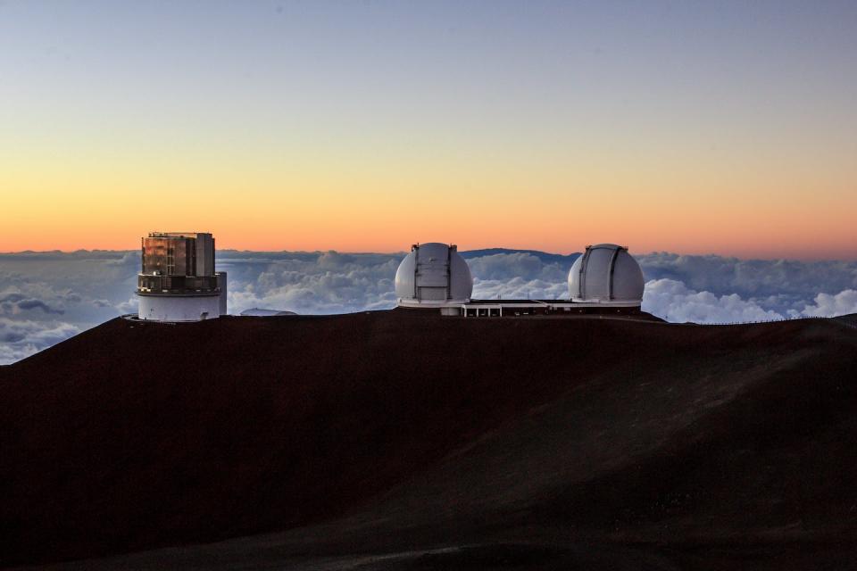 The Subaru, Keck I and Keck II Telescopes at the Mauna Kea Observatories. <a href="https://www.gettyimages.com/detail/news-photo/the-subaru-keck-i-and-keck-ii-telescopes-at-the-mauna-kea-news-photo/494841565?adppopup=true" rel="nofollow noopener" target="_blank" data-ylk="slk:Julie Thurston Photography/Contributor via Getty Images;elm:context_link;itc:0;sec:content-canvas" class="link ">Julie Thurston Photography/Contributor via Getty Images</a>