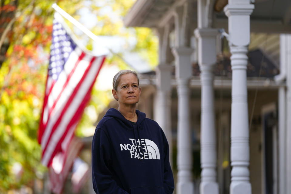 Jennifer Quade poses for The Associated Press, Friday, Nov. 4, 2022, in Chestertown, Md. She moved to the rural community from Baltimore more than 20 years ago and says the U.S. is at a crossroads. (AP Photo/Julio Cortez)