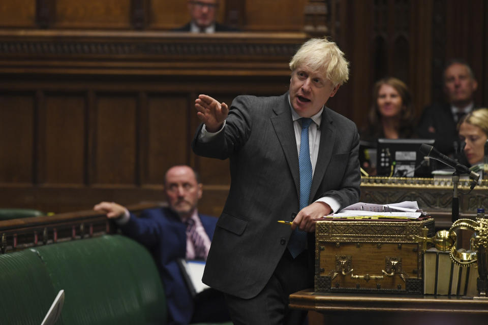 In this handout photo provided by UK Parliament, Britain's Prime Minister Boris Johnson speaks during Prime Minister's Questions in the House of Commons in London, Wednesday, Sept. 16, 2020. U.K. lawmakers have criticized the government’s handling of the COVID-19 testing crisis for a second day as opposition leaders say Prime Minister Boris Johnson lacked a cohesive plan to tackle the virus as the country faces a second wave in the pandemic. (Jessica Taylor/UK Parliament via AP)