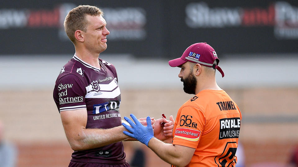 Tom Trbojevic is seen here getting treatment on his shoulder injury.