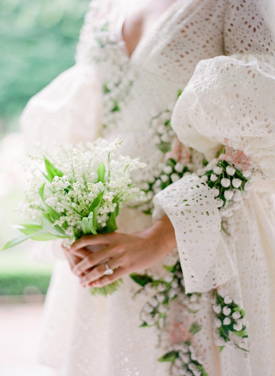 The bouquet! Inspired by the embroidered lily of the valley, Putnam & Putnam created the most beautiful bouquet wrapped in pale pink ribbon to match my dress.