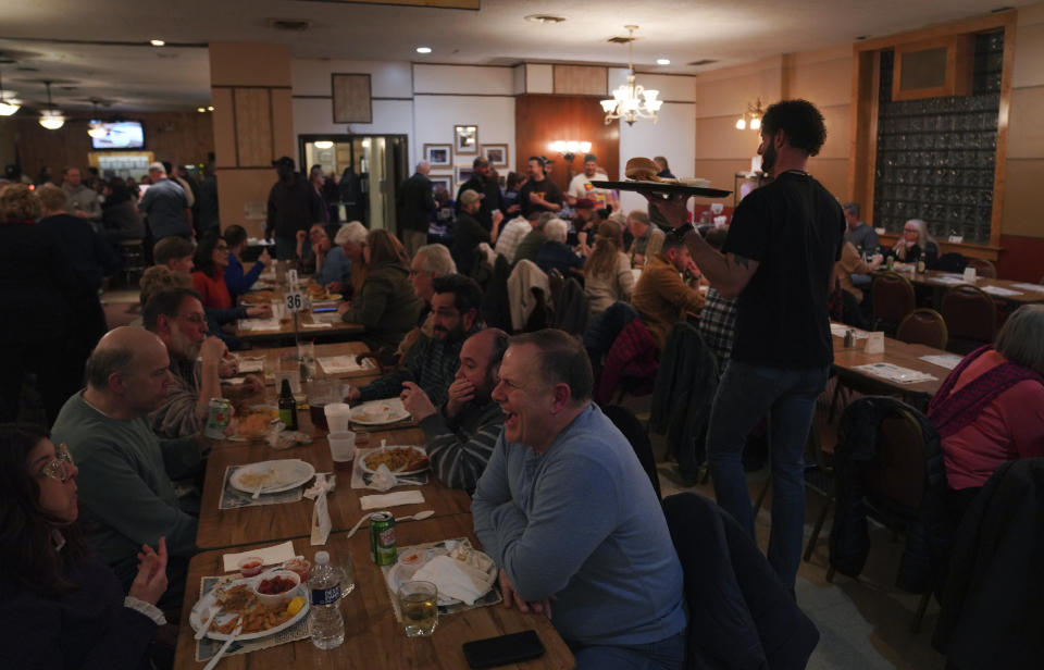 Groups pack the Allegheny Elks Lodge #339 for their annual fish fry on the first night of Lent, in Pittsburgh, on Friday, Feb. 24, 2023. Fish fries have been a longtime Catholic tradition in Western Pennsylvania but increased in popularity in 1966 after the Second Vatican Council announced that not eating meat on Fridays was optional, except during Lent. Today they are held anywhere, from churches to fire stations to restaurants. (AP Photo/Jessie Wardarski)