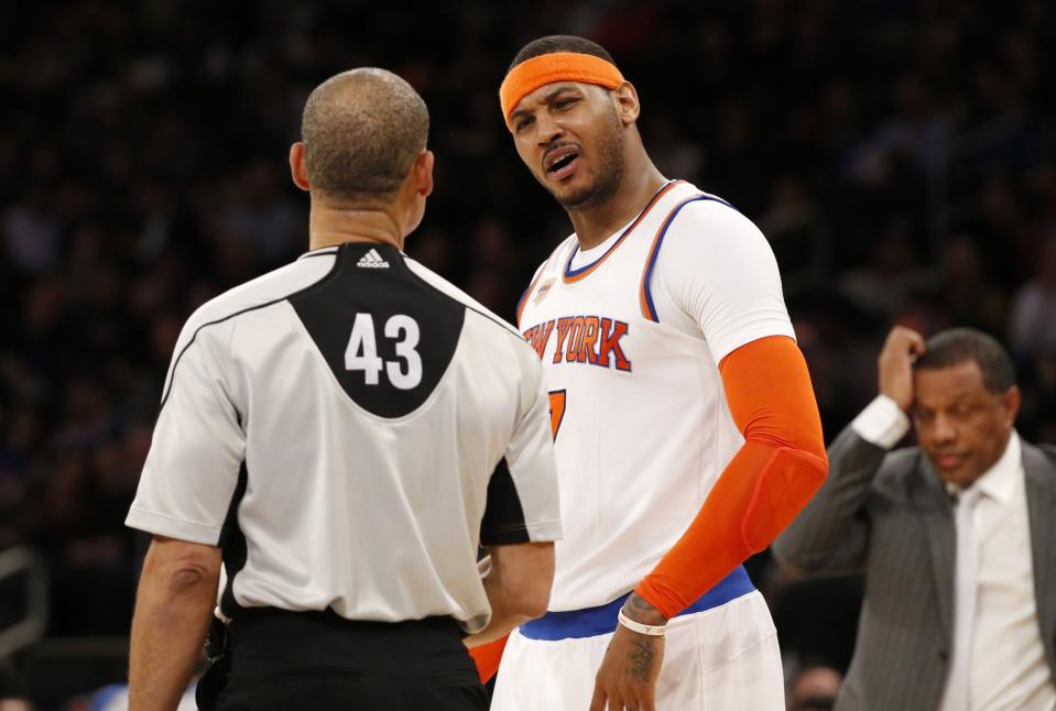 Carmelo Anthony questions referee Dan Crawford, moments before picking up two technical fouls and getting ejected. (AP)
