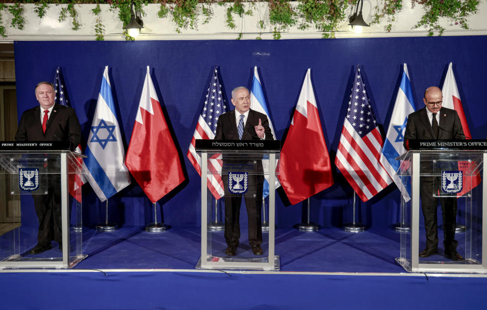 From left to right, U.S. Secretary of State Mike Pompeo, Israeli Prime Minister Benjamin Netanyahu and Bahrain's Foreign Minister Abdullatif bin Rashid Alzayani hold a press conference after their trilateral meeting in Jerusalem on Wednesday, Nov. 18, 2020. (Menahem Kahana/Pool via AP)