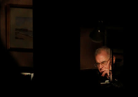 FILE PHOTO: Cardinal Keith O'Brien sits at a desk in a room in his home in Edinburgh, Scotland, Britain February 27, 2013. REUTERS/David Moir/File Photo