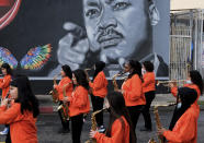 Music students from the Kipp Scholar Academy prepare to participate in the Kingdom Day Parade in Los Angeles, Monday, Jan. 16, 2023. After a two-year hiatus because of the COVID-19 pandemic, the parade, America's largest Martin Luther King Day celebration returned. (AP Photo/Richard Vogel)