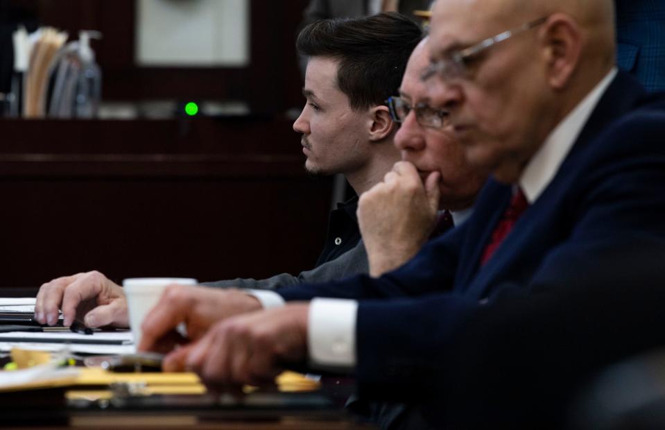 Michael Mosely sits in court while a witness testifies during his trial at Justice A. A. Birch Building in Nashville , Tenn., Tuesday, March 29, 2022. Mosely was charged with two counts of first-degree murder and one each of attempted first-degree murder and assault in connection to a fatal 2019 stabbing at a midtown bar.