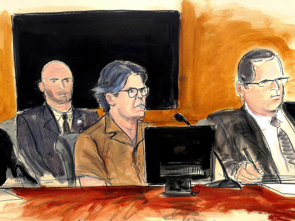 In this courtroom sketch Keith Raniere, second from right, leader of the secretive group NXIVM, attends a court hearing Friday, April 13, 2018.